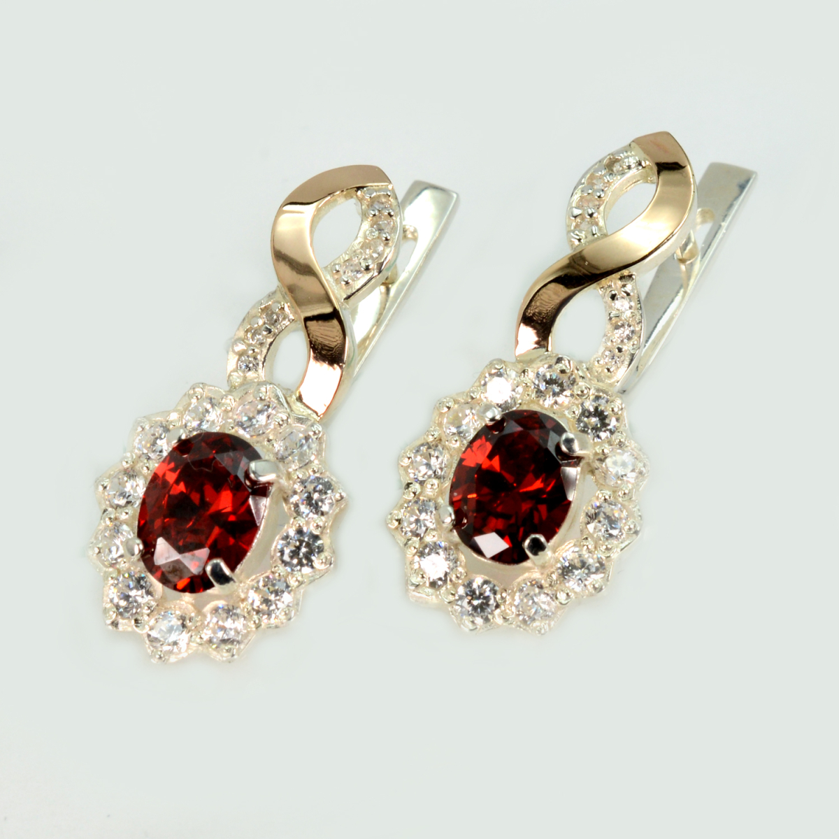 Срібні сережки з золотими напайками