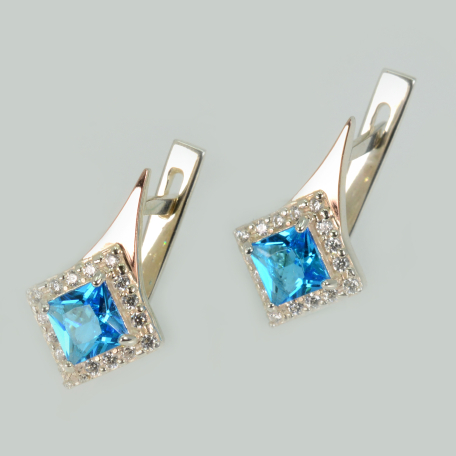 Срібні сережки з золотими напайками