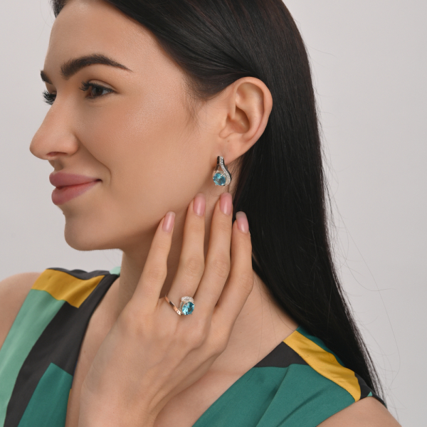 Срібна каблучка з золотими вставками