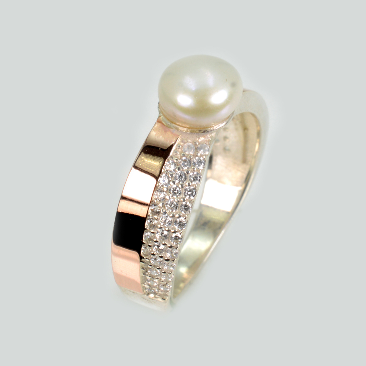 Срібна каблучка з золотими вставками