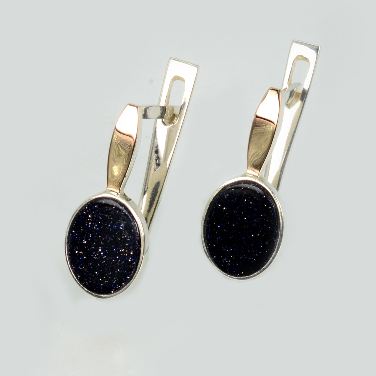 Срібні сережки з золотими пластинами