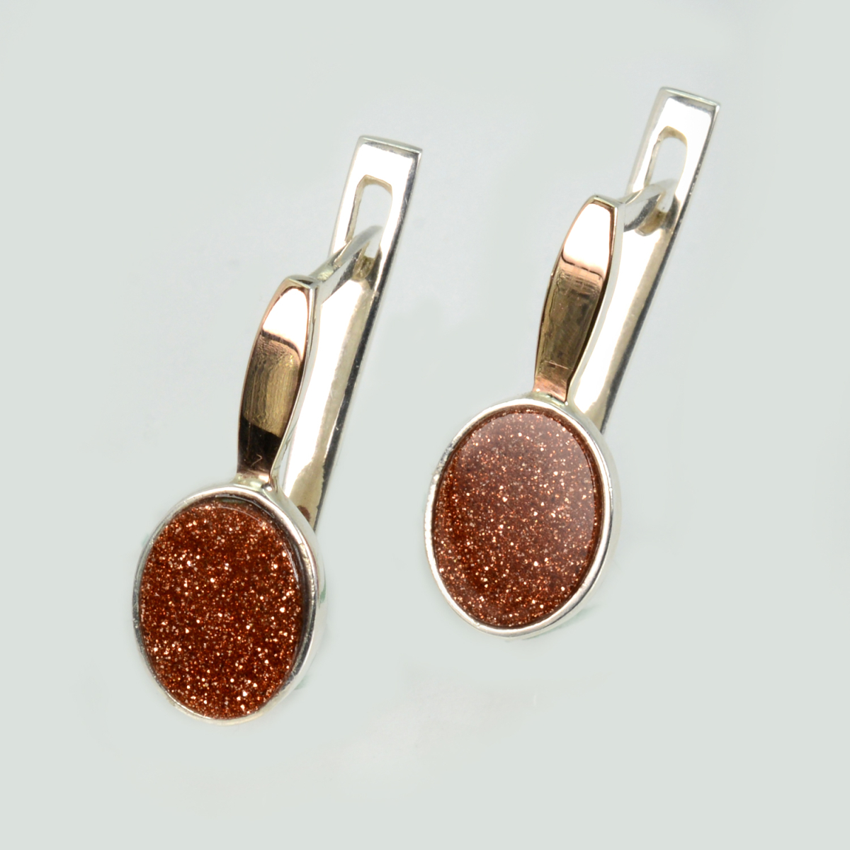 Срібні сережки з золотими пластинами