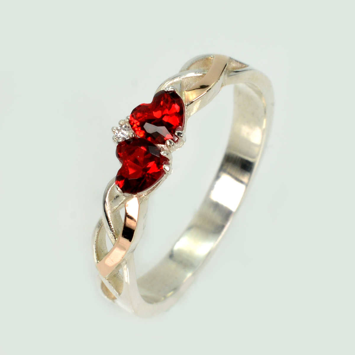 Срібна каблучка з золотими вставками