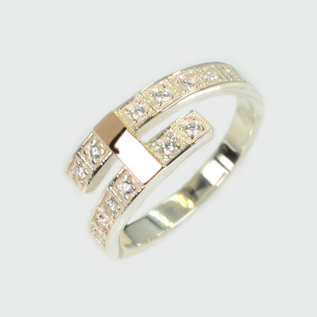 Срібна каблучка з золотими вставками