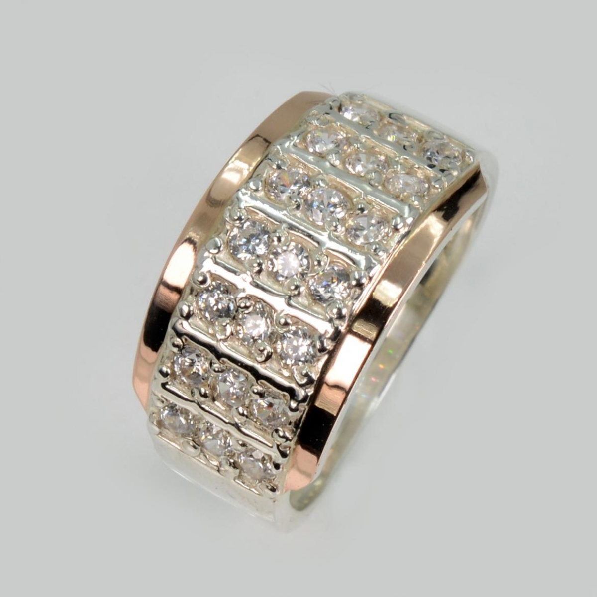 Срібна каблучка з золотими вставками