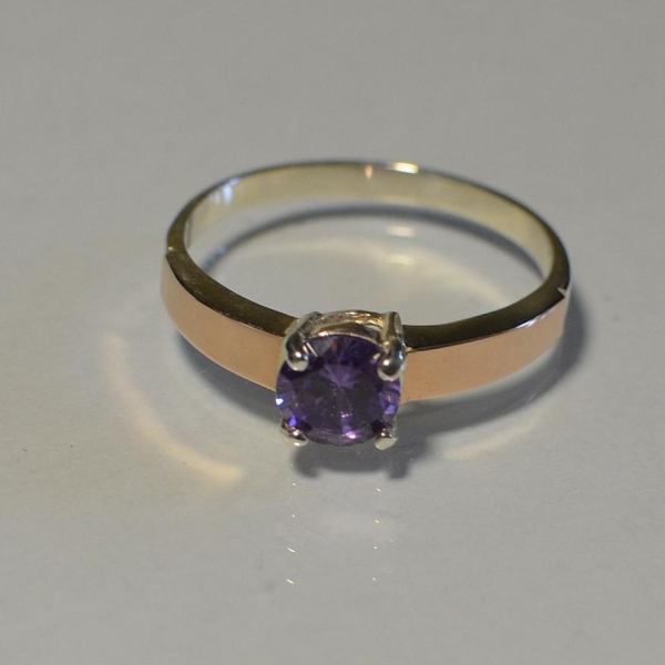 Срібна каблучка з золотими вставками