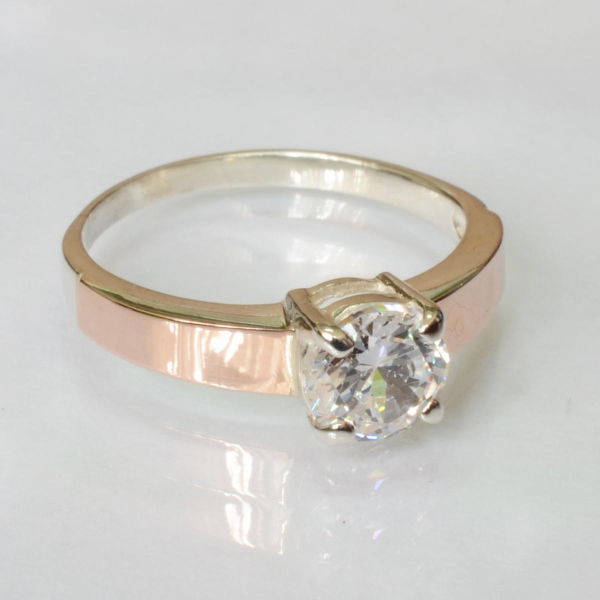 Срібна каблучка з золотими вставками