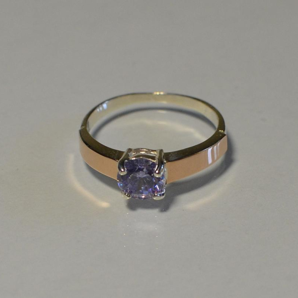 Срібна каблучка з золотими вставками