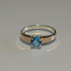 Срібна каблучка з золотими вставками