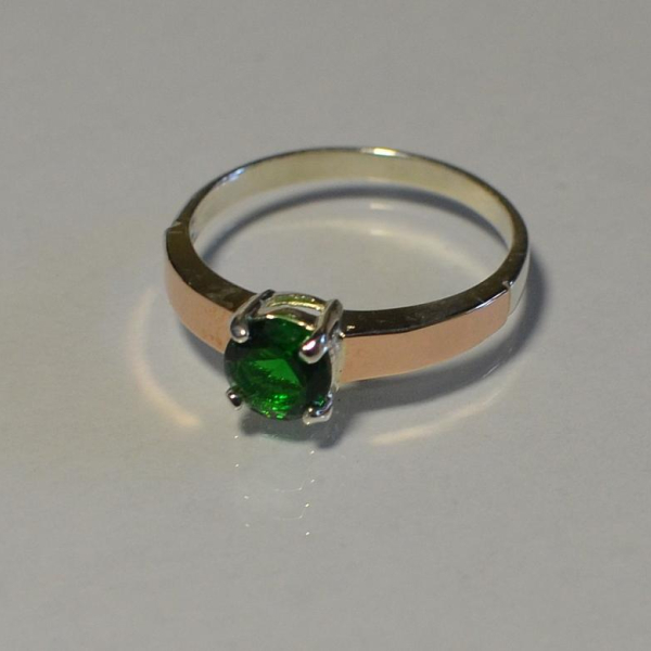 Срібна каблучка з золотими вставками