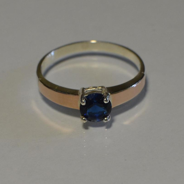 Срібна каблучка з золотими вставками