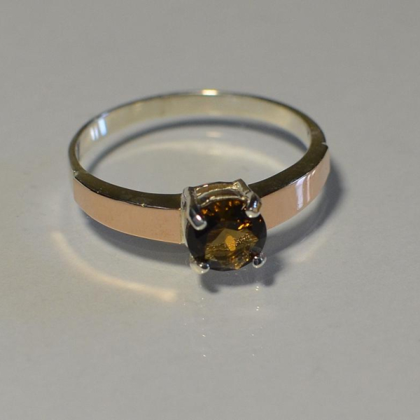 Срібна каблучка з золотими вставками