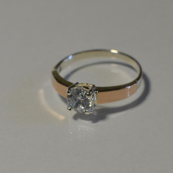 Срібна каблучка з золотими вставками