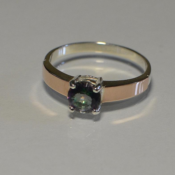 Срібна каблучка з золотими вставками