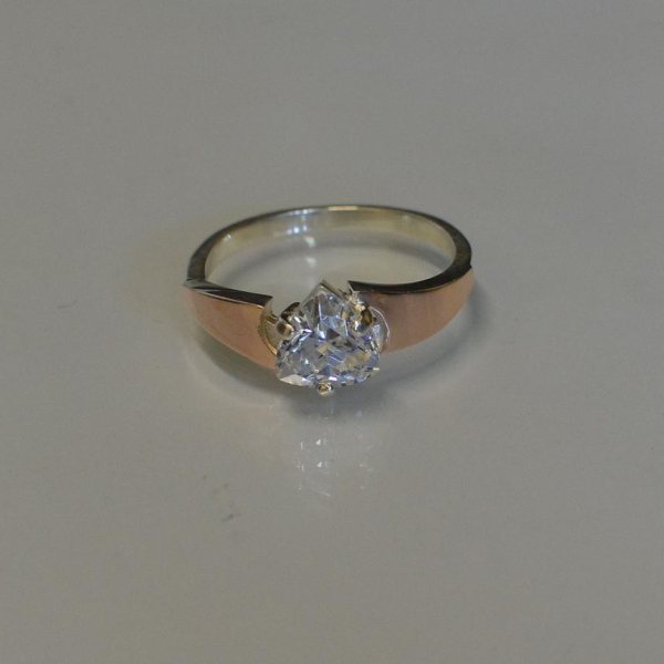 Срібна каблучка з золотими вставками