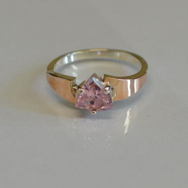 Срібна каблучка з золотими вставками