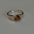 Срібна каблучка з золотими вставками