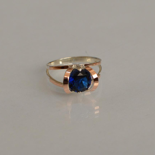 Срібна каблучка з золотими вставками