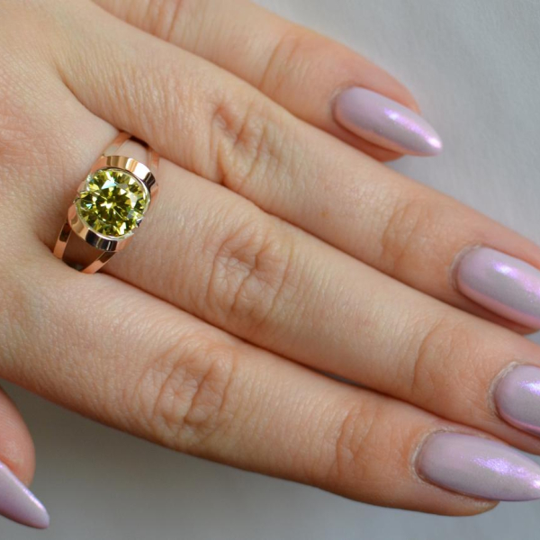 Срібна каблучка з золотими вставками