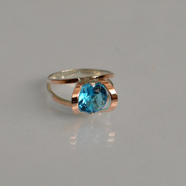 Срібна каблучка з золотими вставками