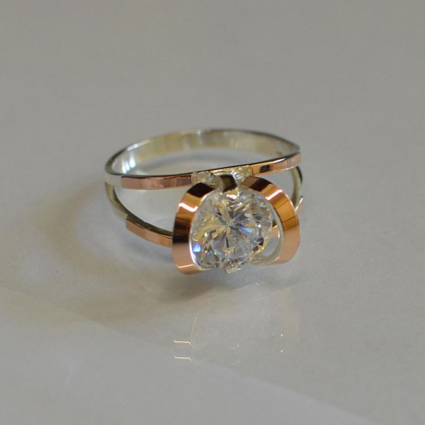 Срібна каблучка з золотими вставками