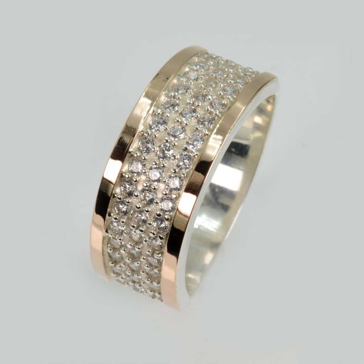 Срібна каблучка з золотими пластинами