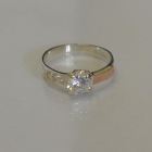 Срібна каблучка з золотими вставками