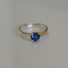 Срібна каблучка з золотими вставками