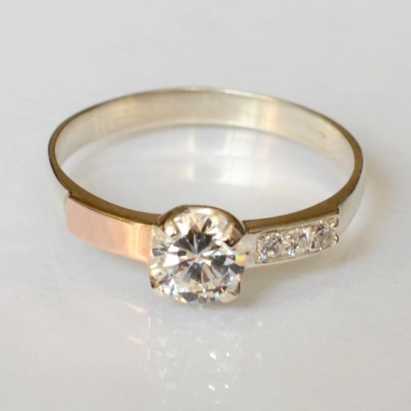 Срібна каблучка з золотими вставками