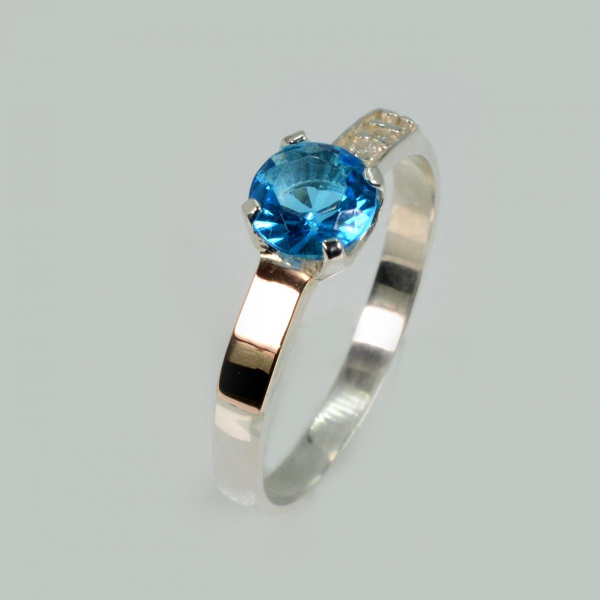 Срібна каблучка з золотими вставками