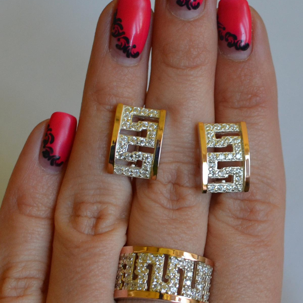 Срібний набір із золотими пластинами