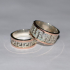 Пара срібних обручок з золотими вставками