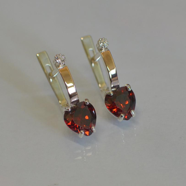 Срібні сережки з золотими напайками