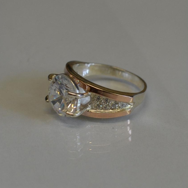 Срібна каблучка з золотими пластинами