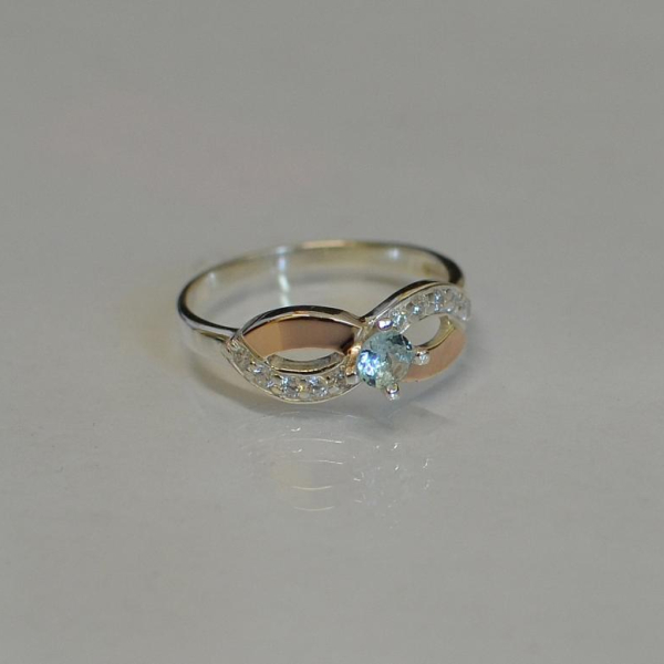 Срібна каблучка з золотими накладками