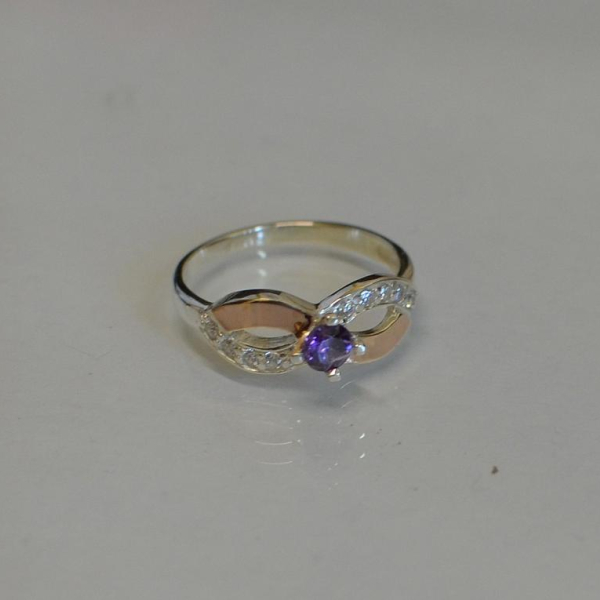 Срібна каблучка з золотими накладками