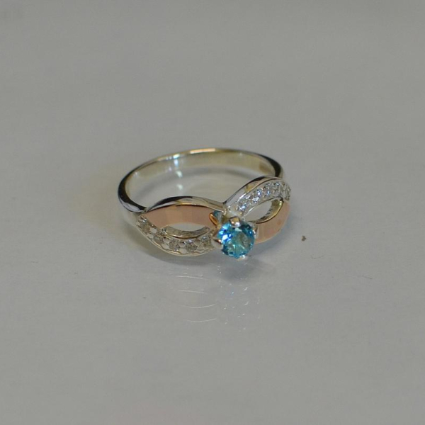 Срібна каблучка з золотими накладками