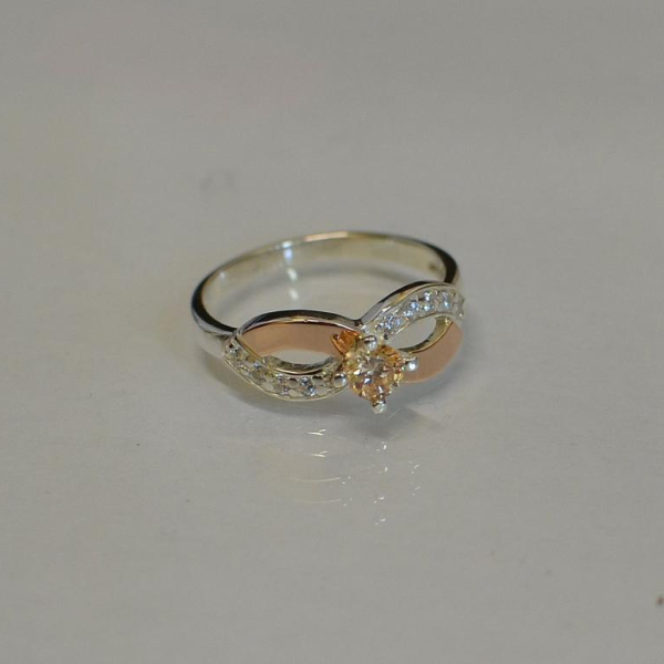 Срібна каблучка з золотими накладками