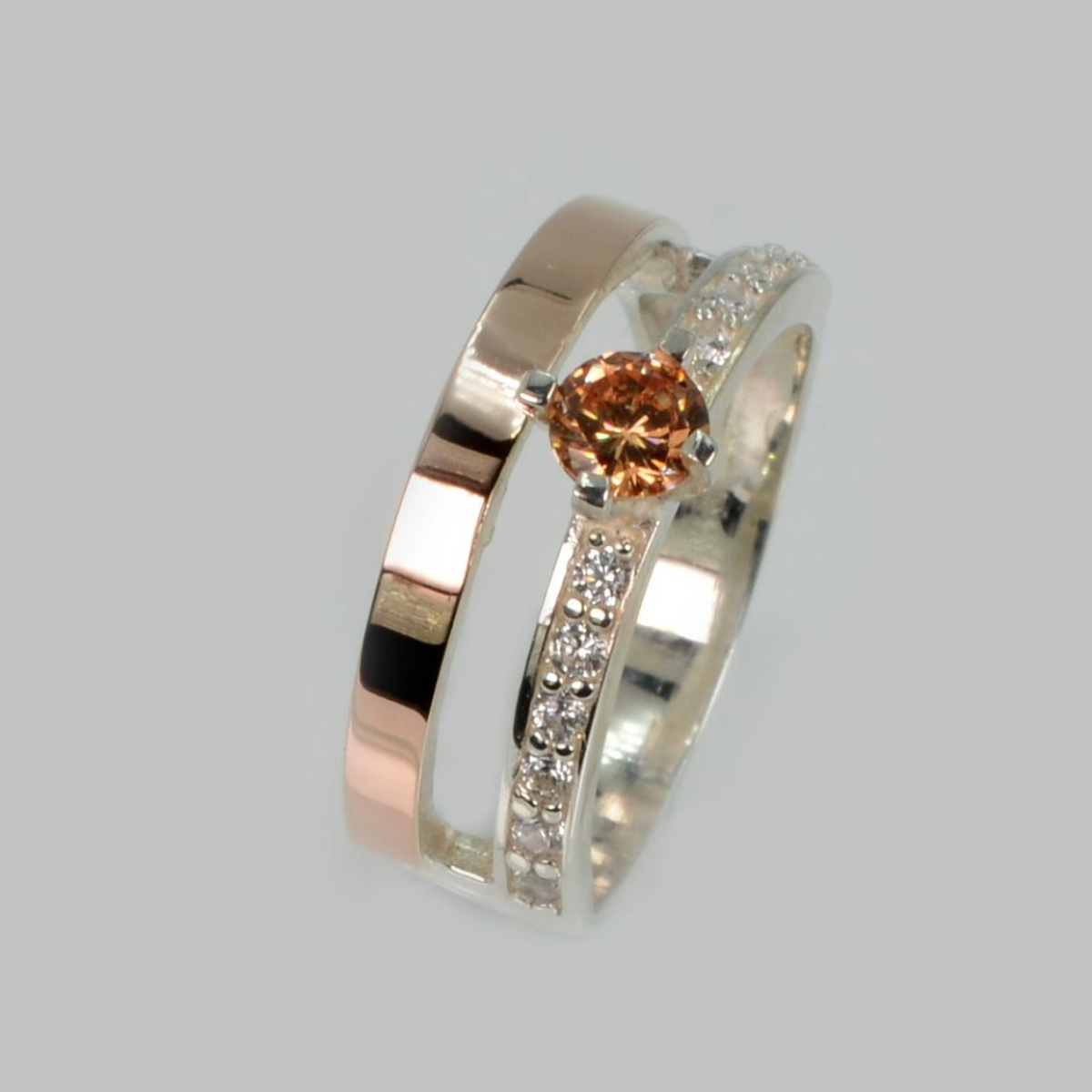 Срібна каблучка з накладками з золота