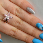 Срібна каблучка з золотими вставками