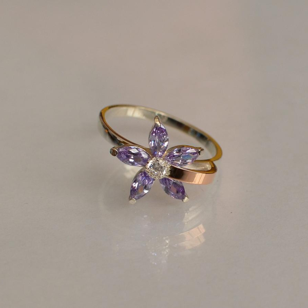 Срібна каблучка з золотими вставками