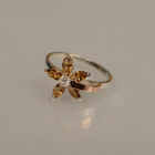 Срібна каблучка з золотими вставками