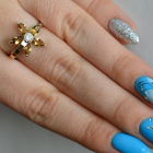 Срібна каблучка з золотими вставками