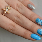 Срібна каблучка з золотими вставками