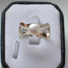 Срібна каблучка з золотими вставками