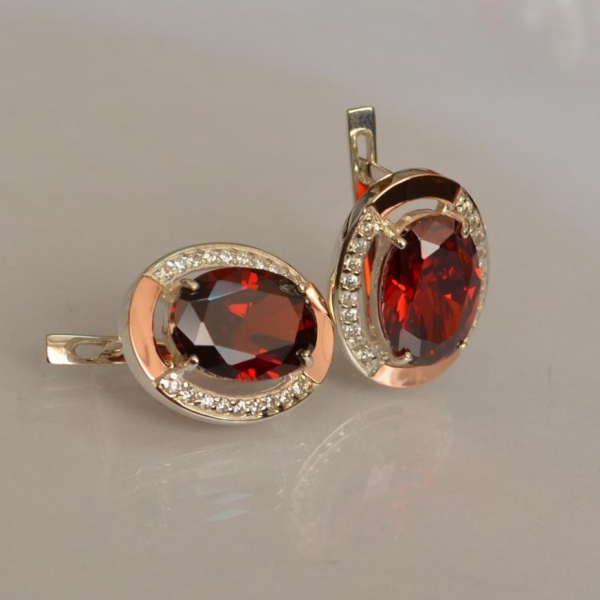 Срібні сережки з золотими вставками