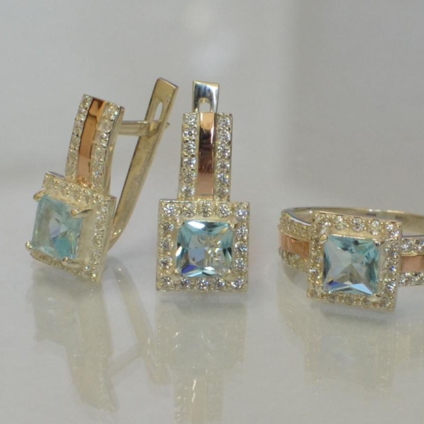 Срібний набір із золотими вставками