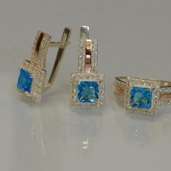 Срібний набір із золотими вставками