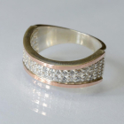 Срібна каблучка з накладками з золота