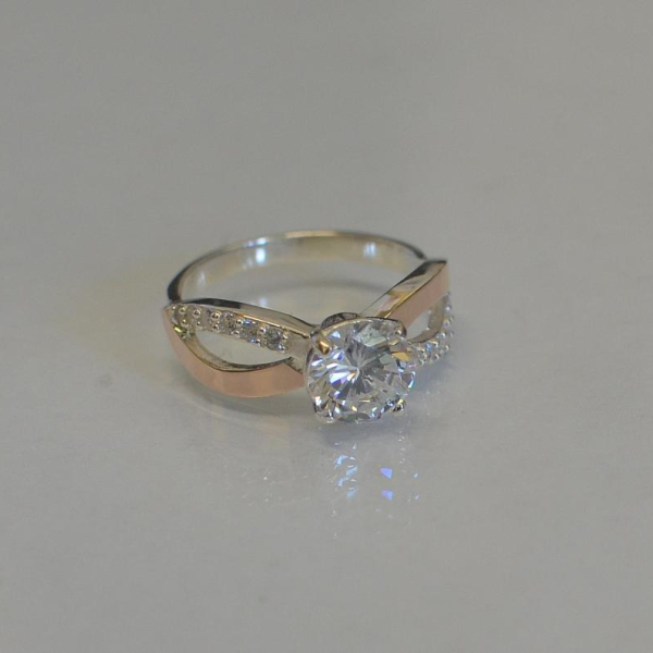 Срібна каблучка з золотими вставками